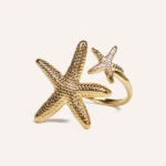 Anillo Estrella Mar de acero dorado