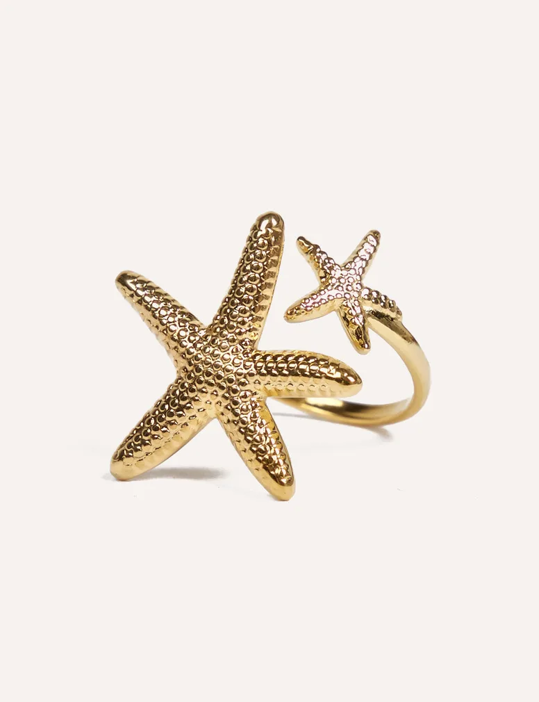 Anillo Estrella Mar de acero dorado